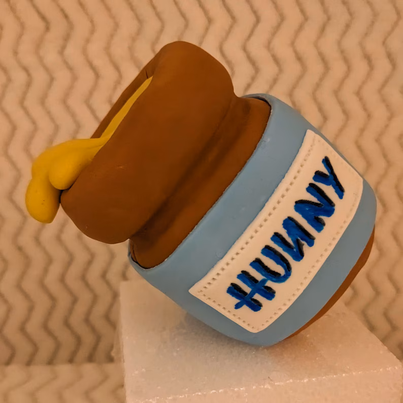 Honey-pot cake topper for a Pooh Bear baby shower
